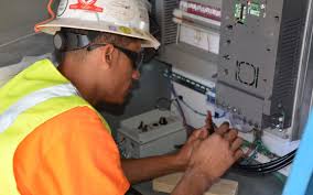 Engineer troubleshooting industrial automation equipment